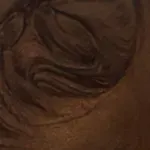 A close up of a chocolate swirl on a table.