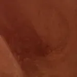 A close up of a person 's face with a red background.