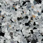A close up of a pile of white and black rocks.