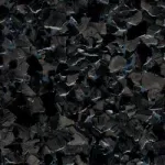A close up of a pile of black rocks.