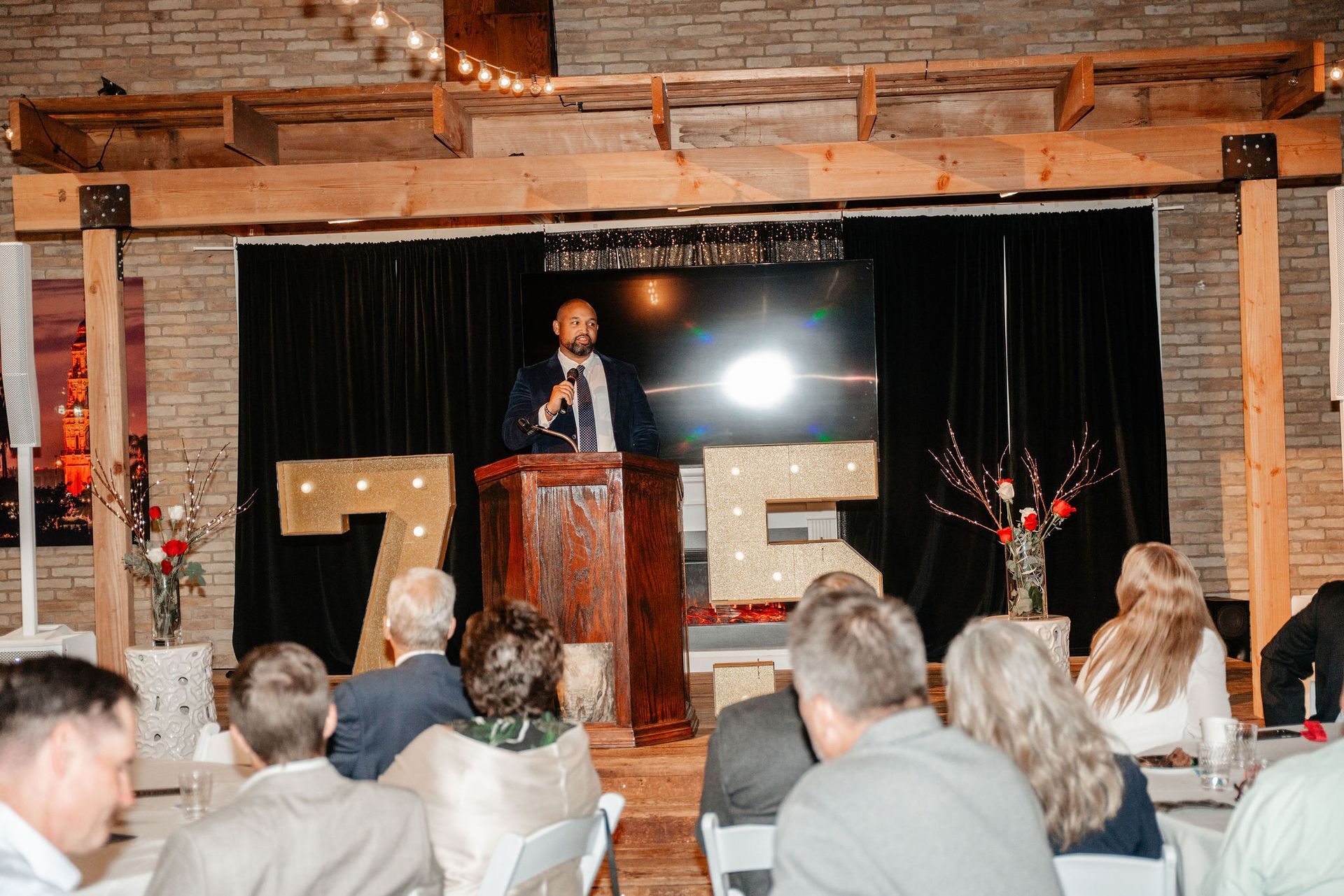 Man speaking at podium, 