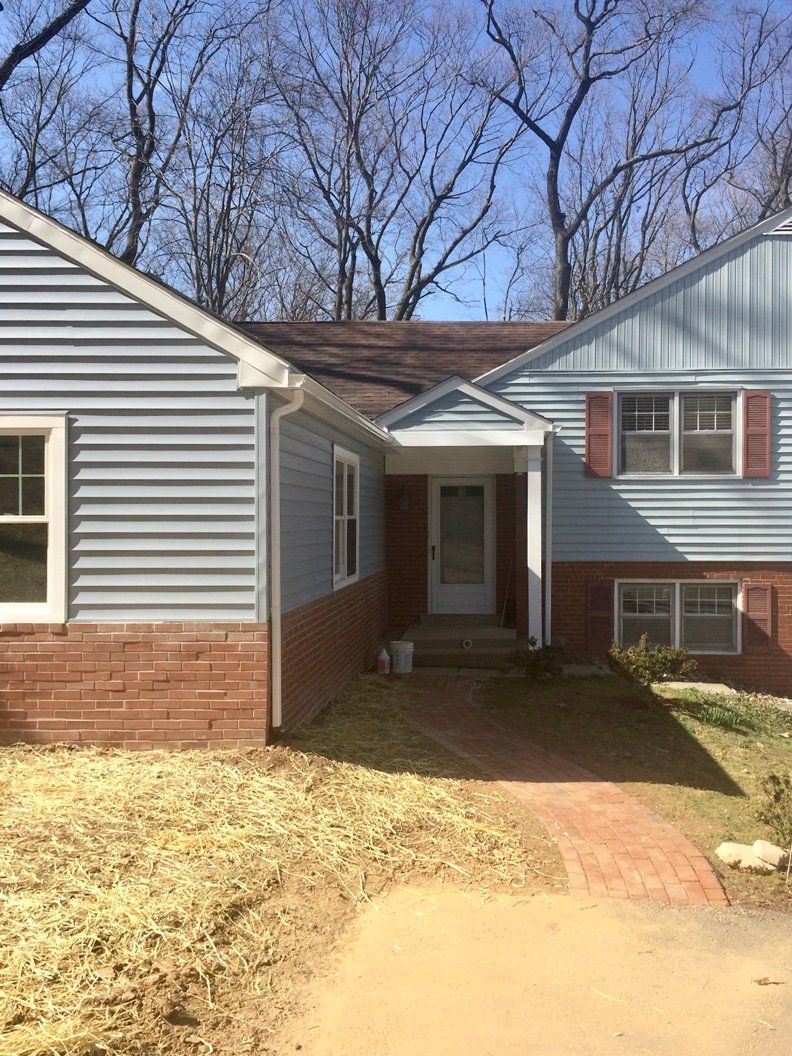 House With Siding And Brick Wall — Parkesburg, PA — E.P. Hannum Building