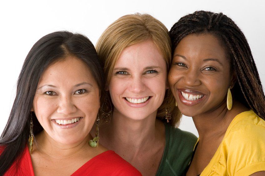 Three women are posing for a picture and smiling for the camera for beauty products offers