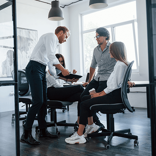 a group of young professionals having a meeting