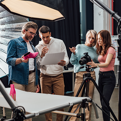 a group of creative professionals in a studio