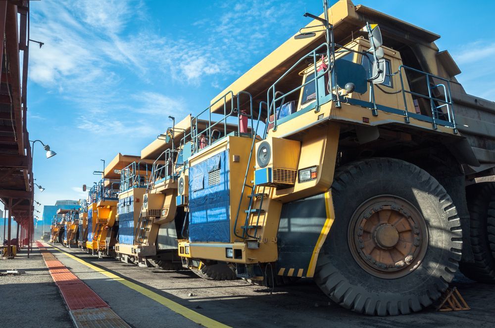 Yellow and Green Front-end Loaders Working in a Sandy Quarry — Waite Diesel Service in Douglas, QLD