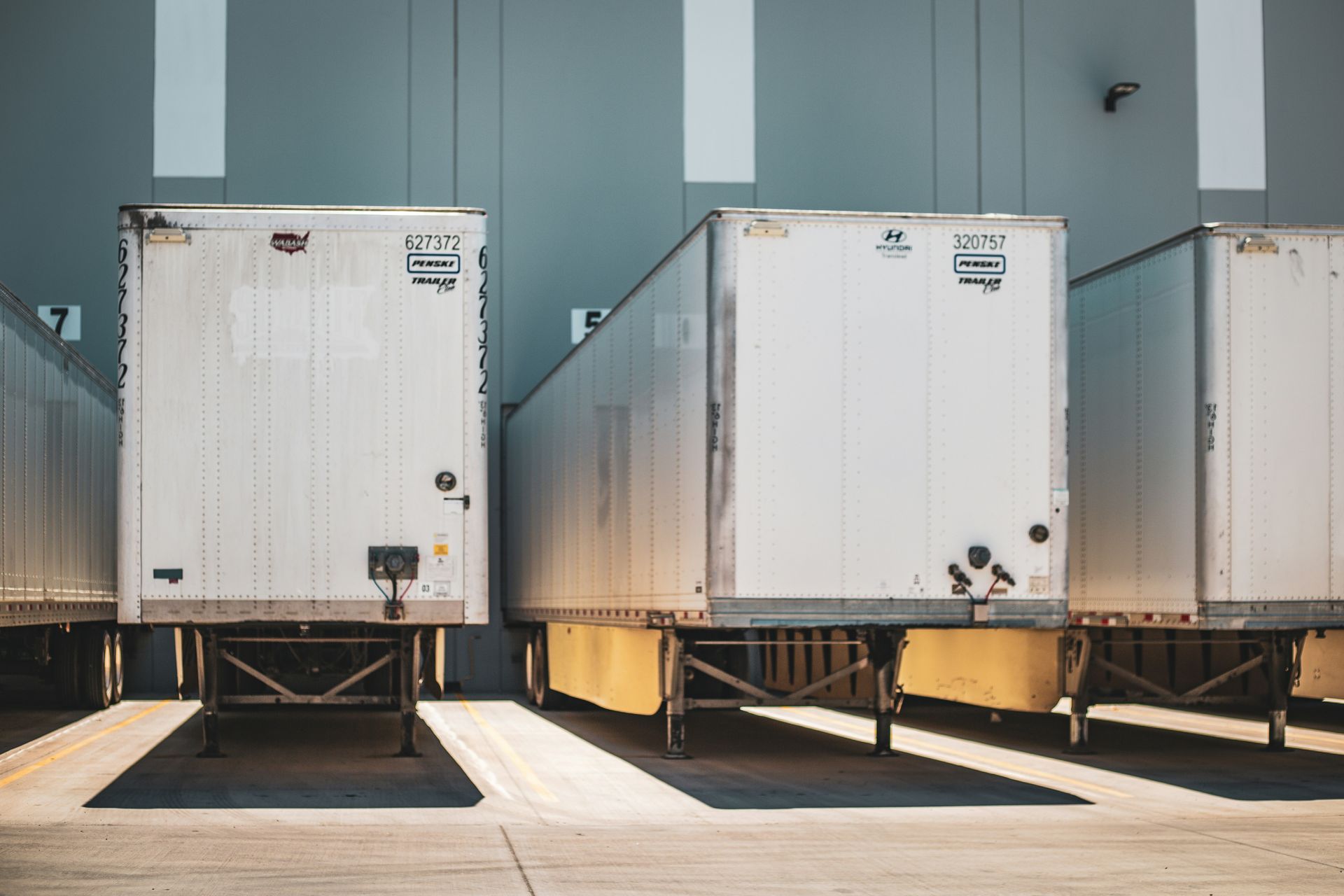 White Semi-trailer Trucks Parked at a Loading Dock — Waite Diesel Service in Douglas, QLD