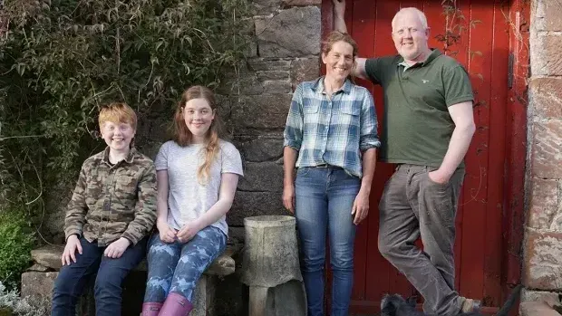Image of the Lee Family on their farm