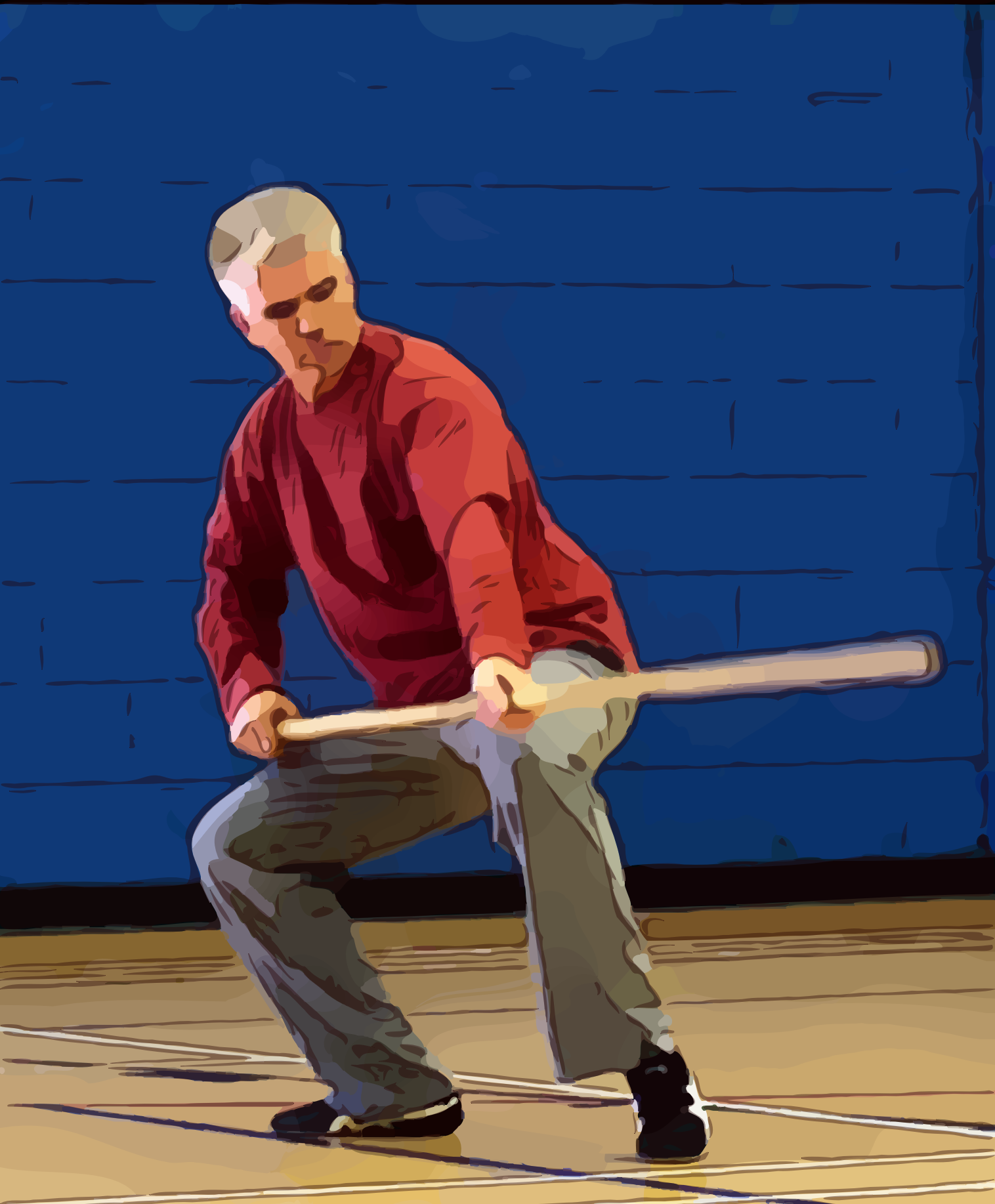 A man in a red shirt is holding a wooden spear