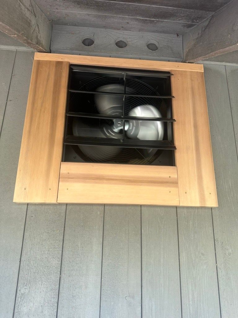 A window with a fan inside of it