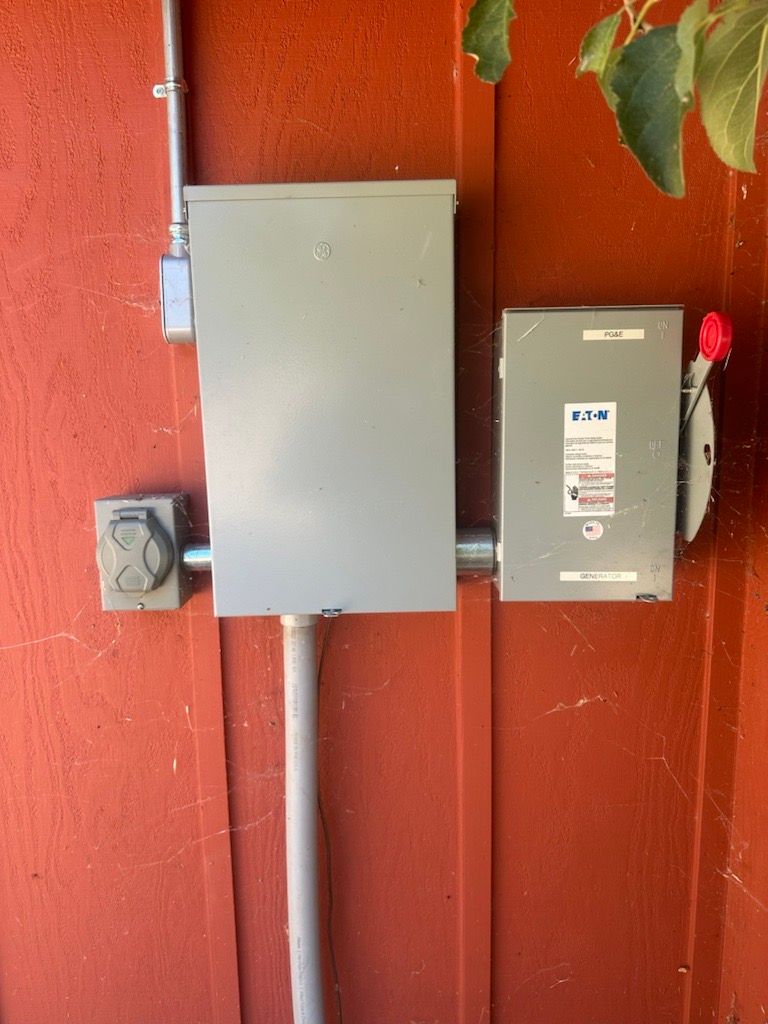 A red wall with a box and a switch on it.