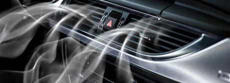 Air conditioning vent with smoke or vapor.