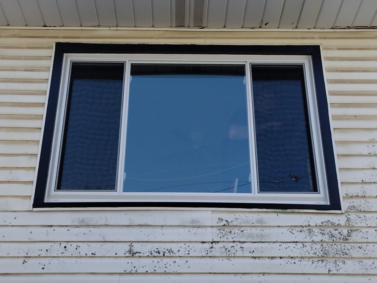 A large window on the side of a house