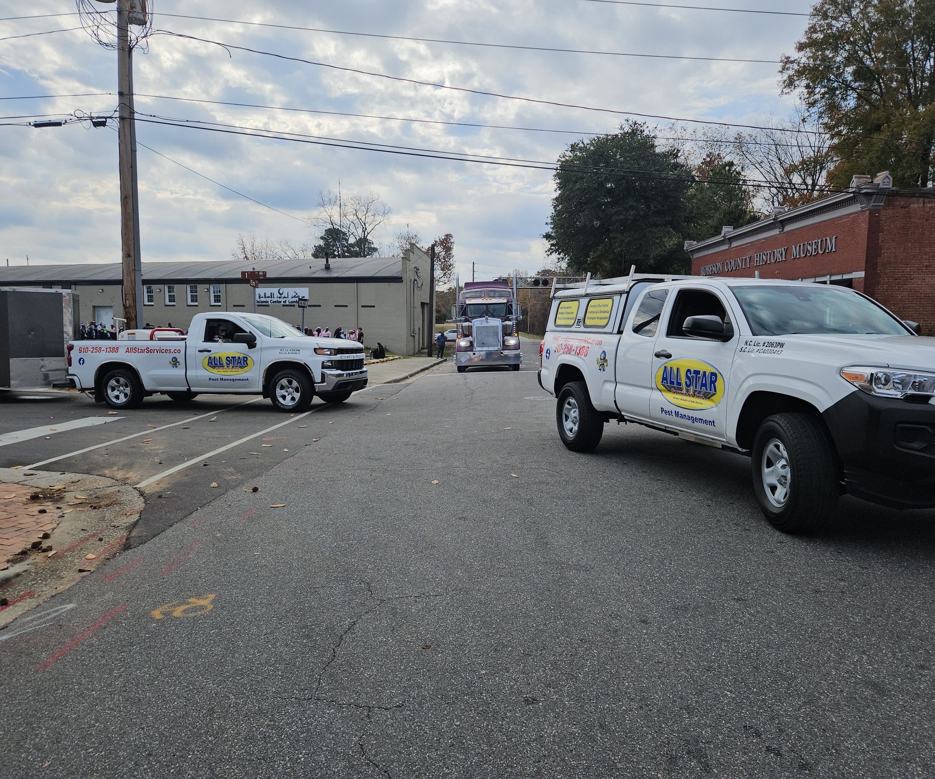 Two white service trucks with