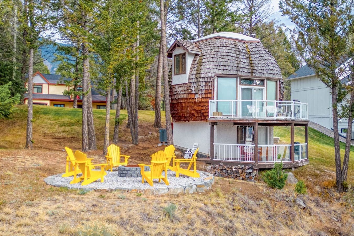 A living room with a large sectional couch and a coffee table.