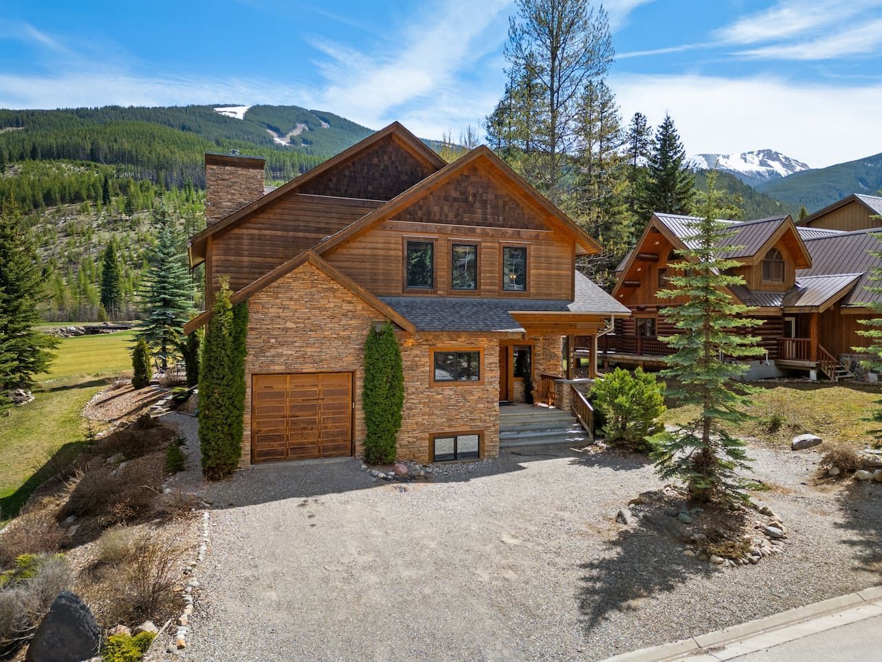 A living room with a large sectional couch and a coffee table.