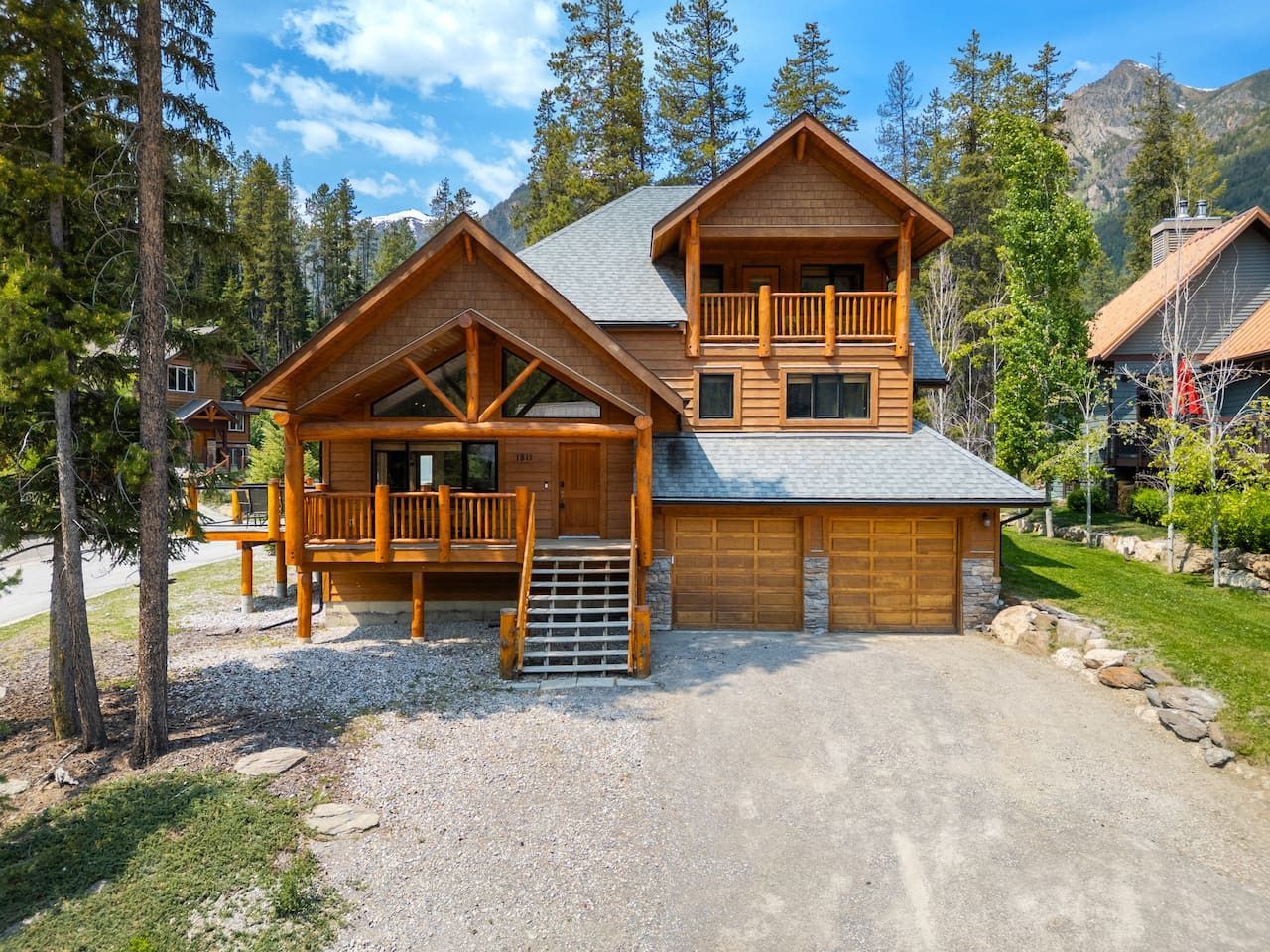 A living room with a couch , chair , coffee table and sliding glass doors.