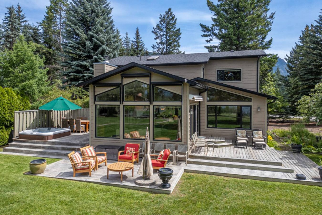 A living room with a couch , chair , coffee table and sliding glass doors.