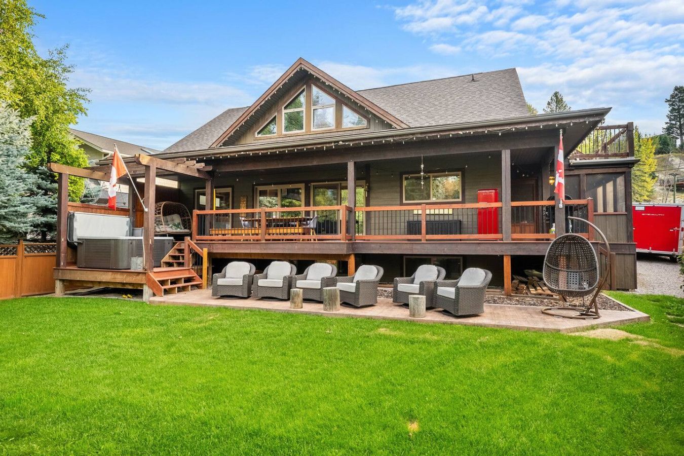A living room with two couches , a fireplace and a flat screen tv.