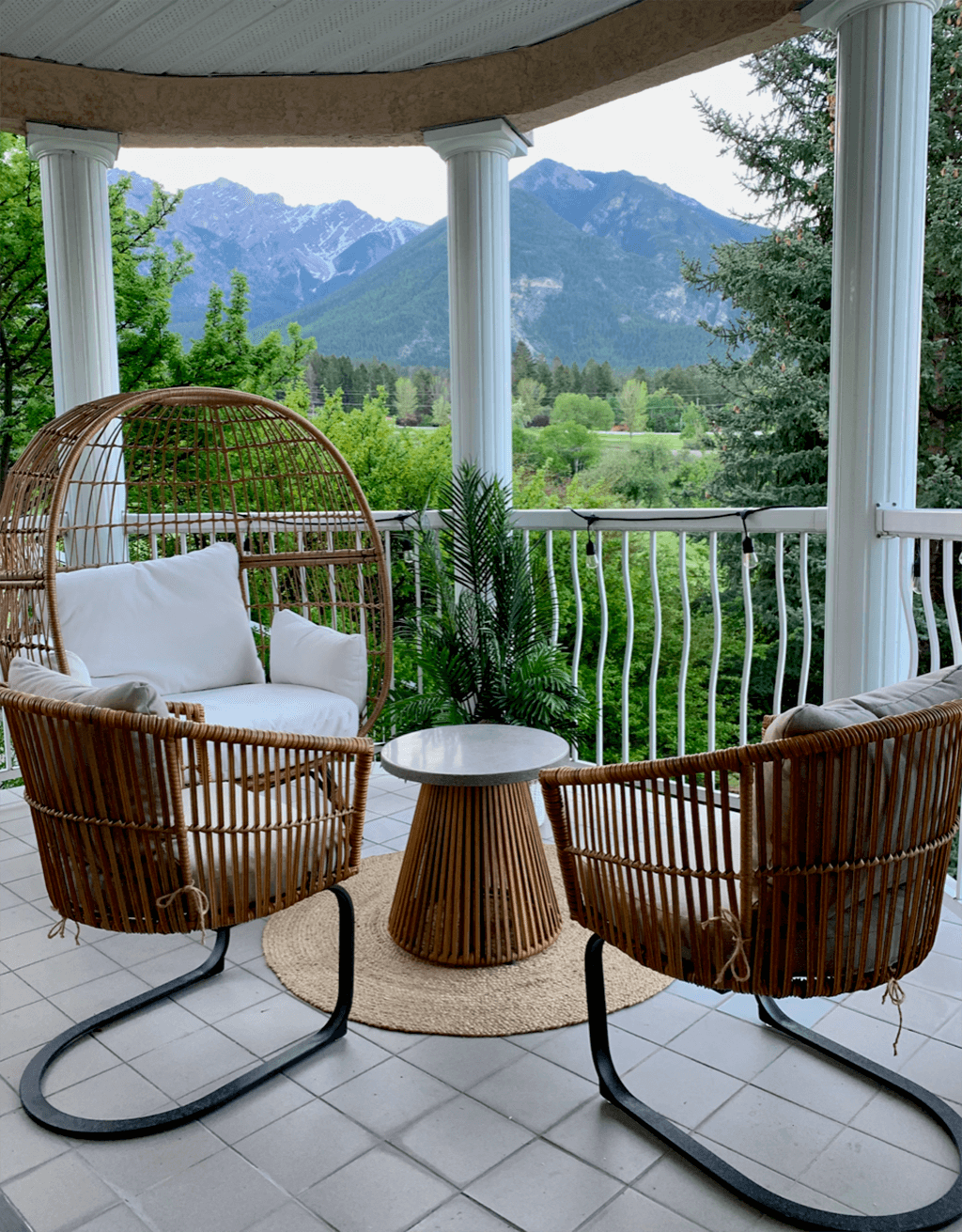 Private patio outdoor seating with golf course views at the Fairmont Hot Springs Oasis, a Scandinavian themed BC Vacation Rental hosted by Aisling Baile Property Management.