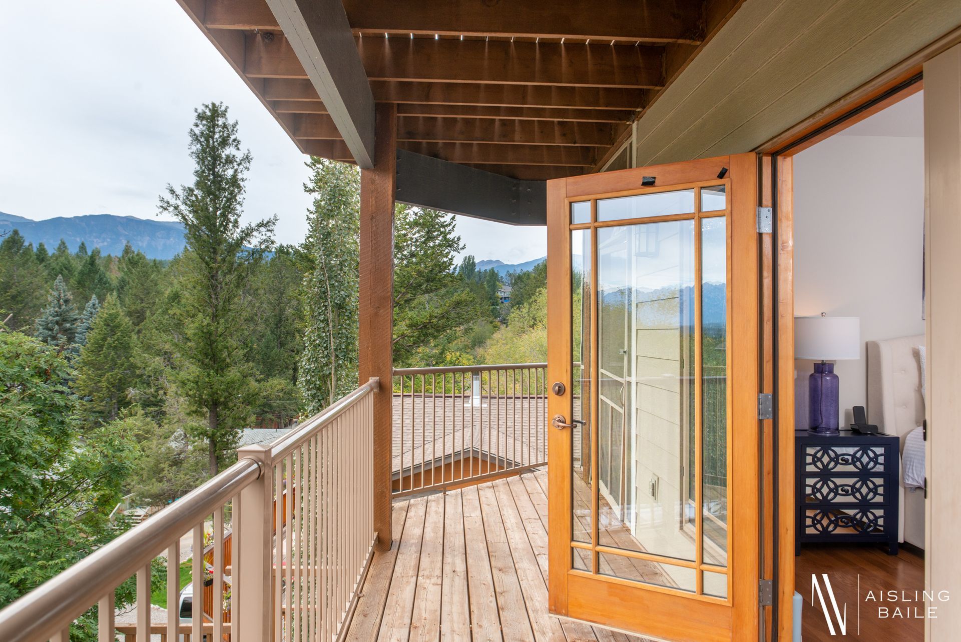 Private patio with lake and mountain views from Central Elegance, an Invermere BC Vacation Rental hosted by Aisling Baile Property Management.
