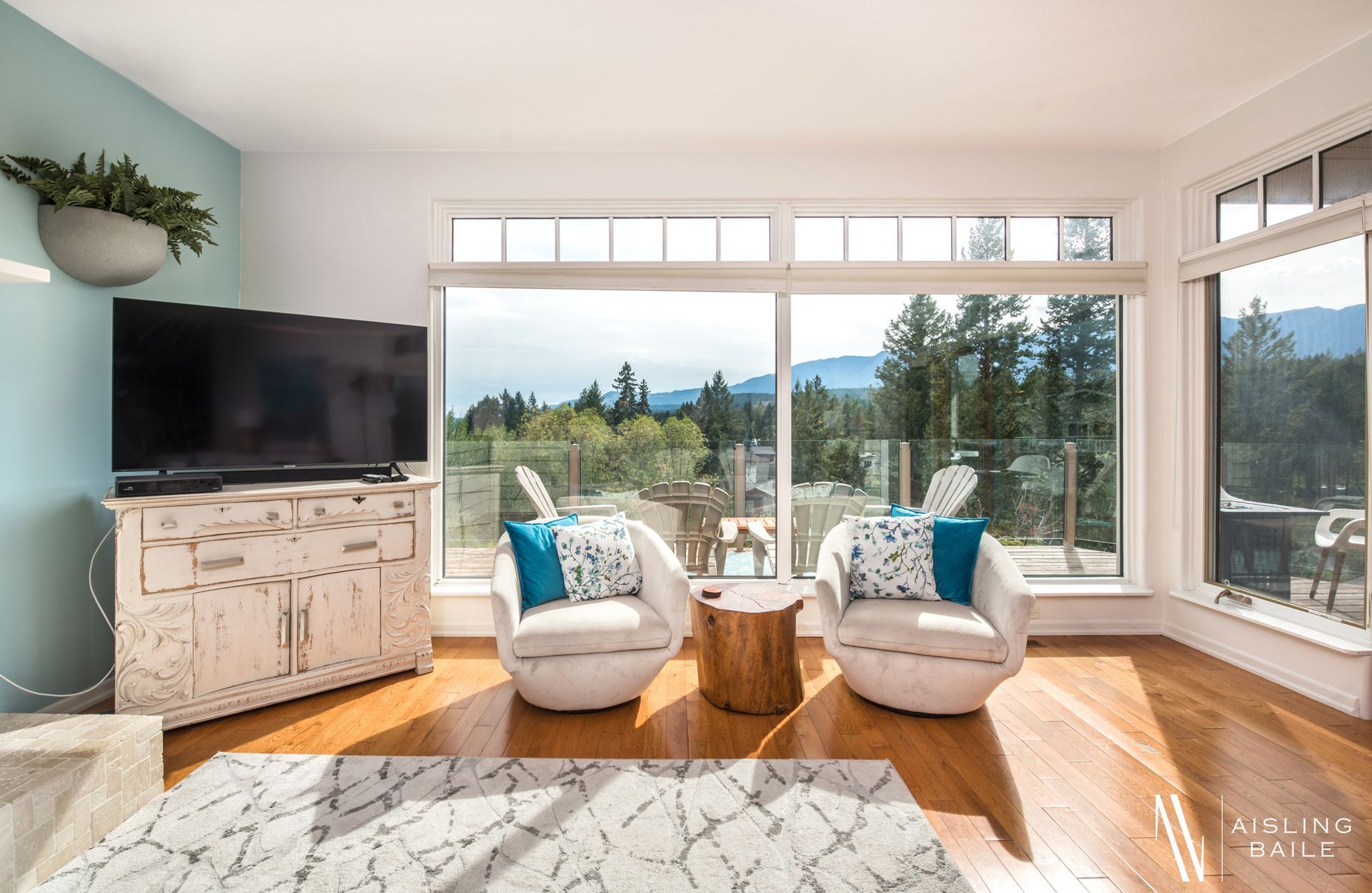 Main floor living room with mountain views of the Central Elegance, an Invermere BC Vacation Rental hosted by Aisling Baile Property Management.