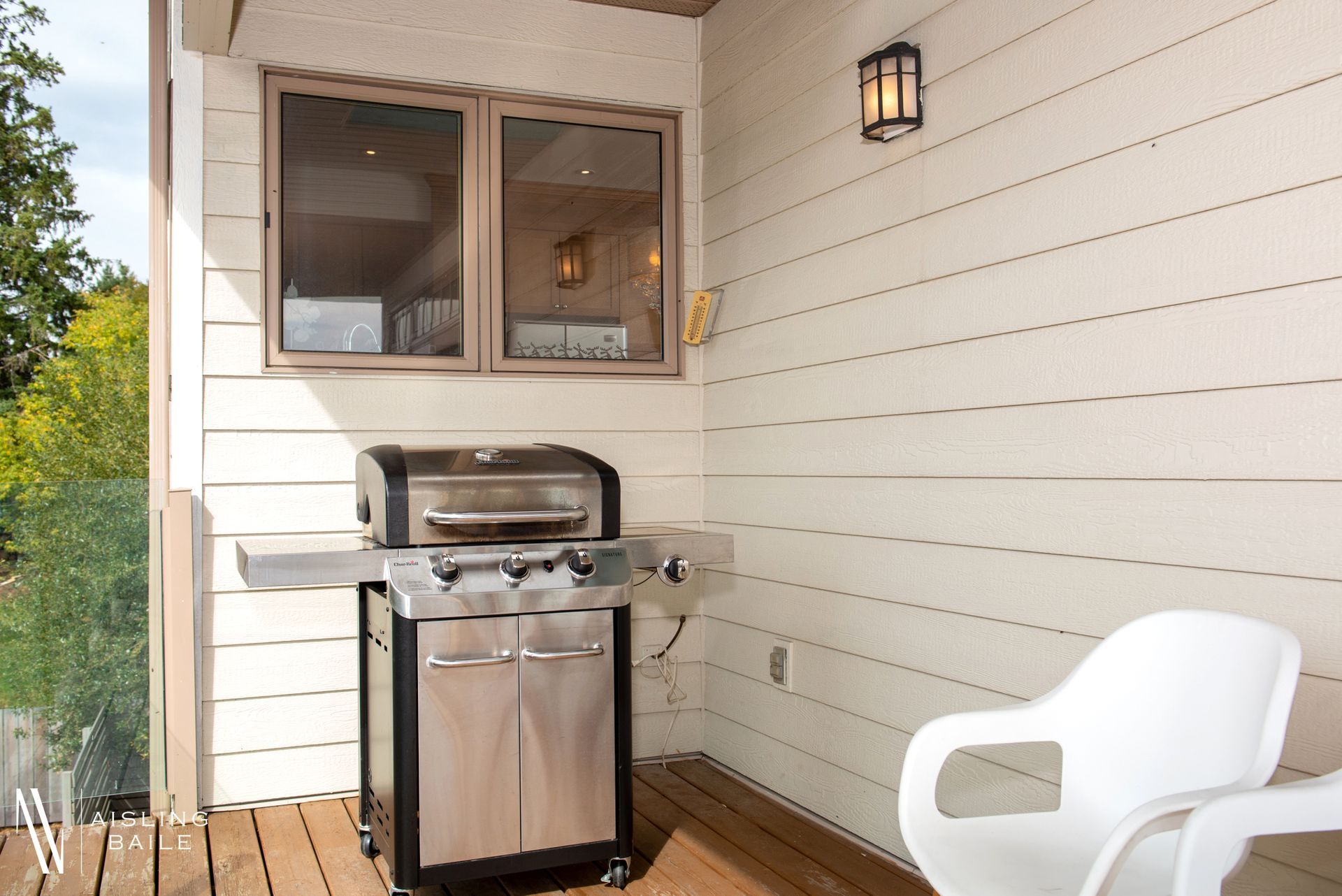 Private patio swing & BBQ with lake and mountain views from Central Elegance, an Invermere BC Vacation Rental hosted by Aisling Baile Property Management.