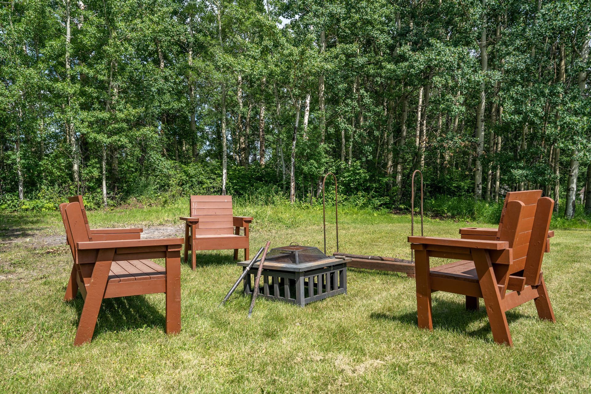 Private fire pit of Hilltop Hideaway, a Rimbey Gull Lake short-term rental hosted by Aisling Baile Property Management.
