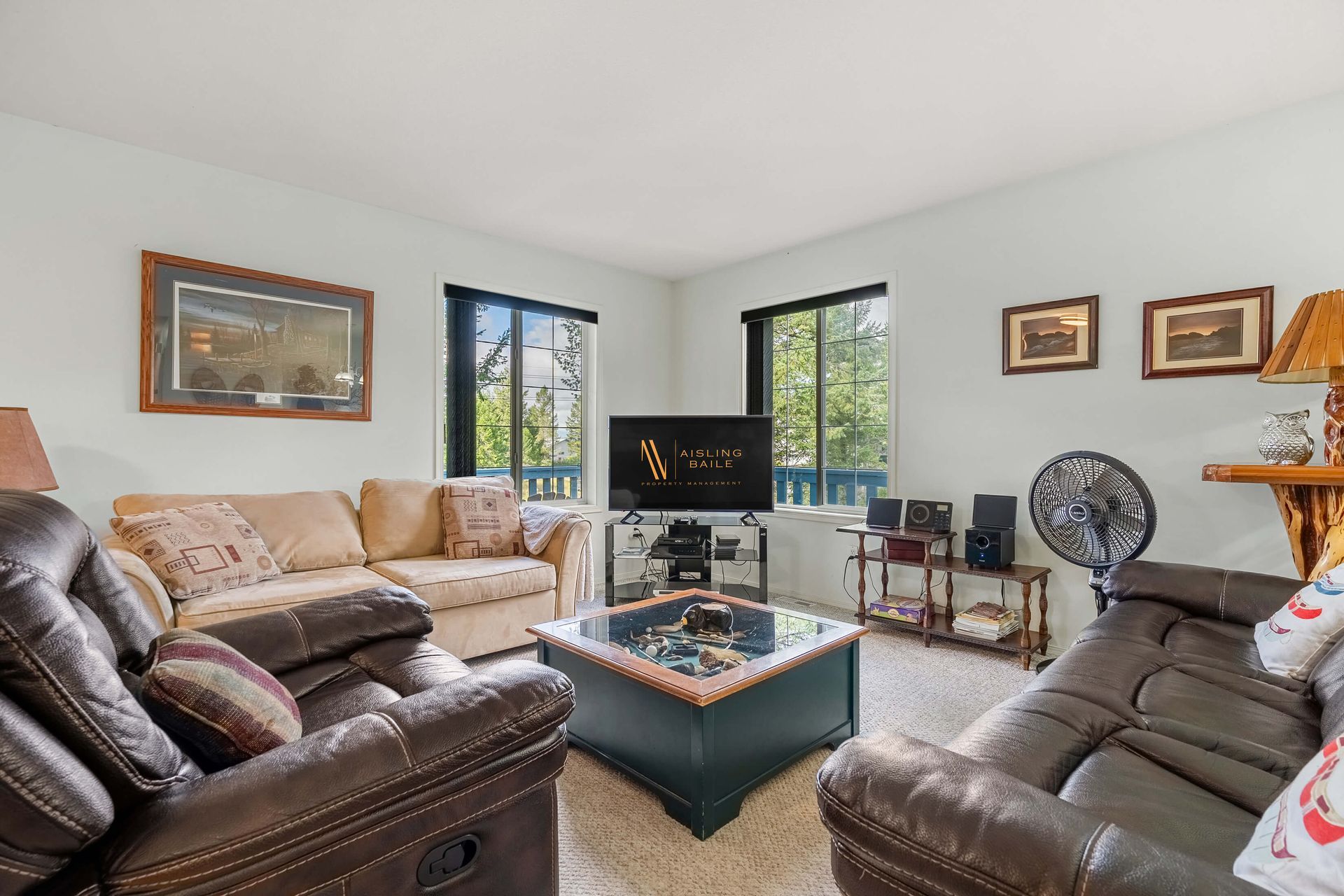 A living room filled with furniture and a flat screen tv.