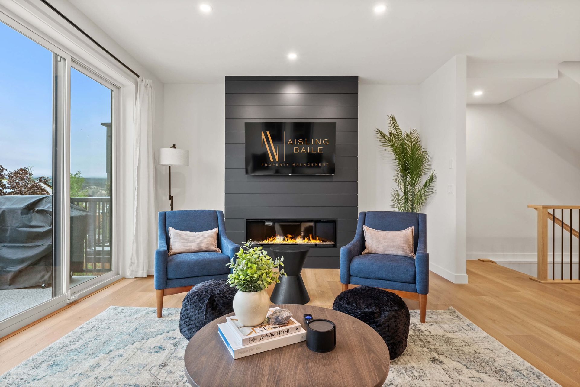A person wearing blue gloves is cleaning a door handle with a spray bottle.