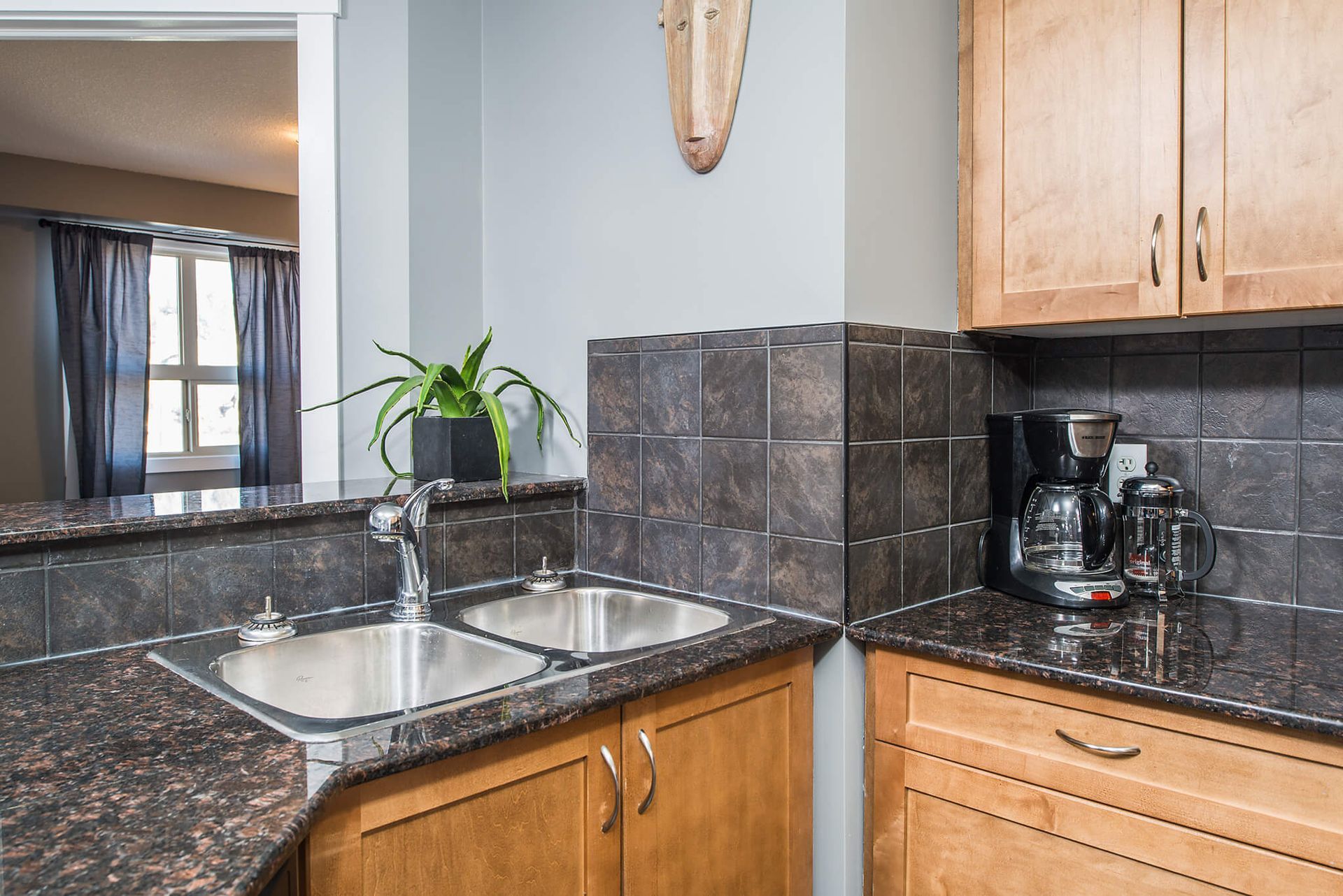 Full kitchen in the lake view condo in Lake Windermere Pointe BC Vacation Rental in Invermere hosted by Aisling Baile Property Management. 