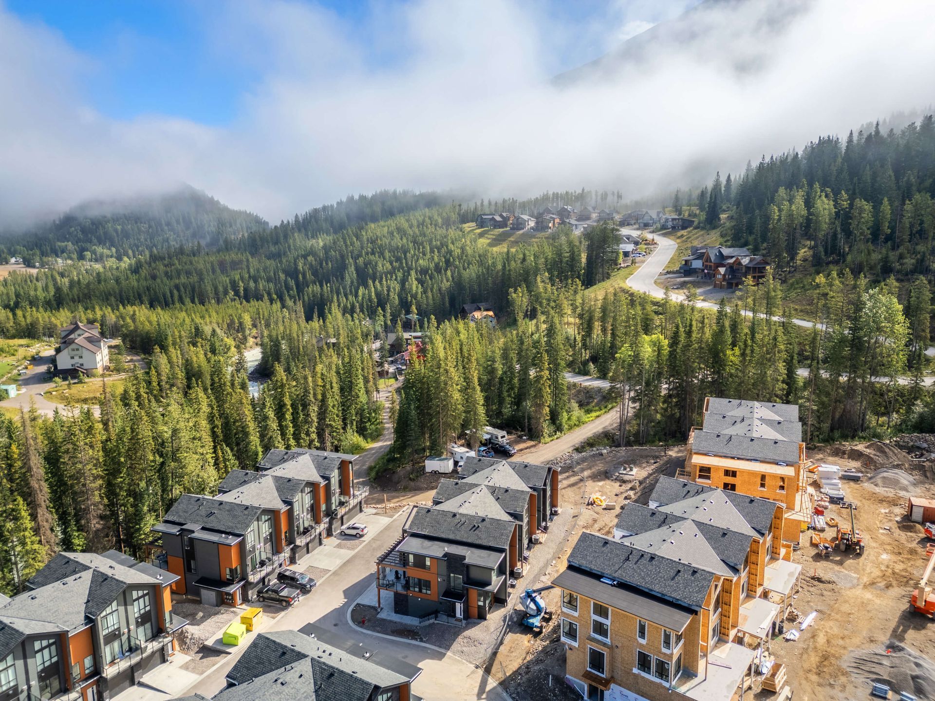 A city street with a clock tower in the middle of it