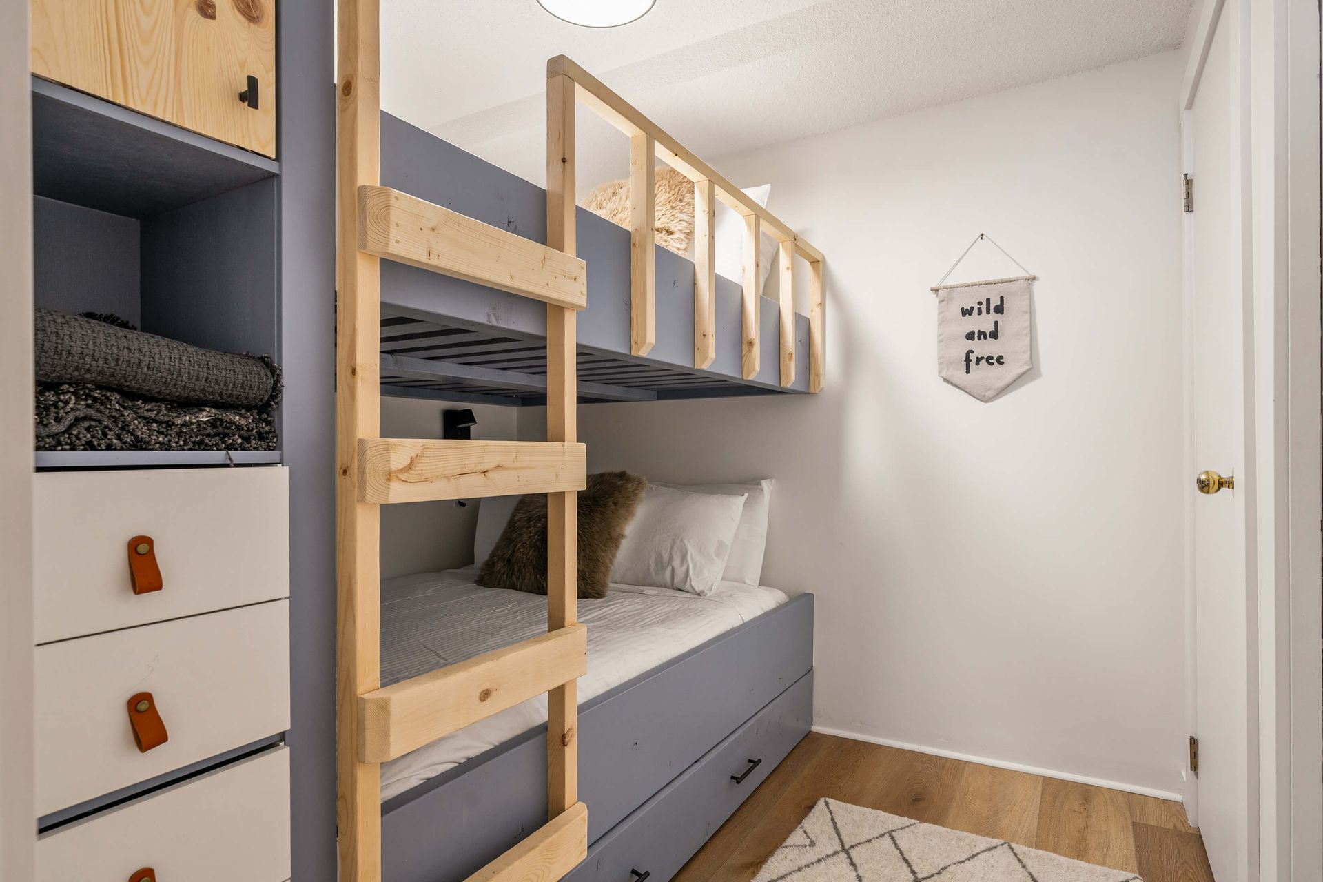 Double-over-double bunk bed of the Apres Adventure, a ski-in/ski-out Panorama BC Vacation Rental hosted by Aisling Baile Property Management.