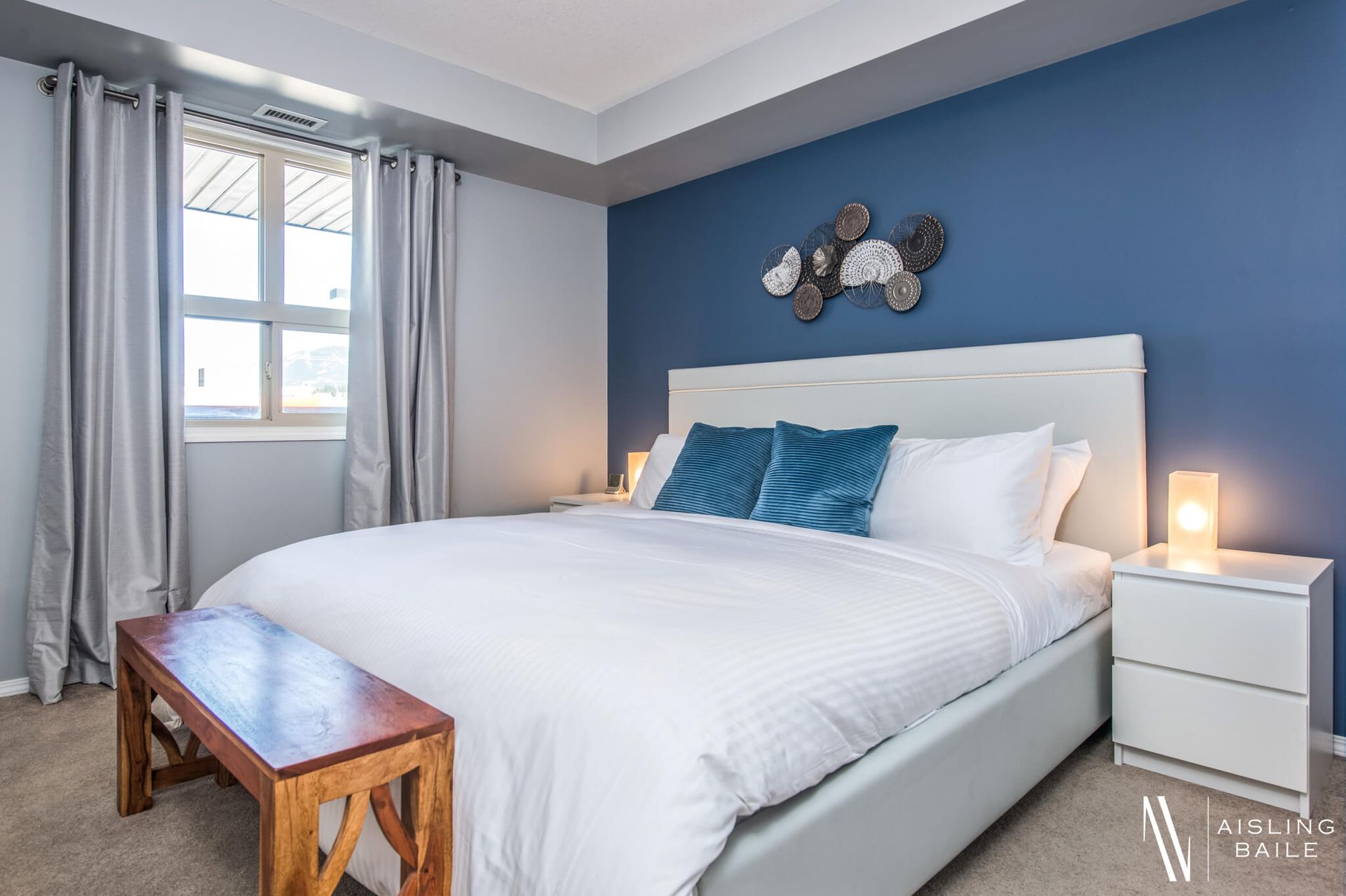 Primary bedroom at the Trendy condo at Lake Windermere Pointe in Invermere, a BC Vacation Rental hosted by Aisling Baile Property Management.
