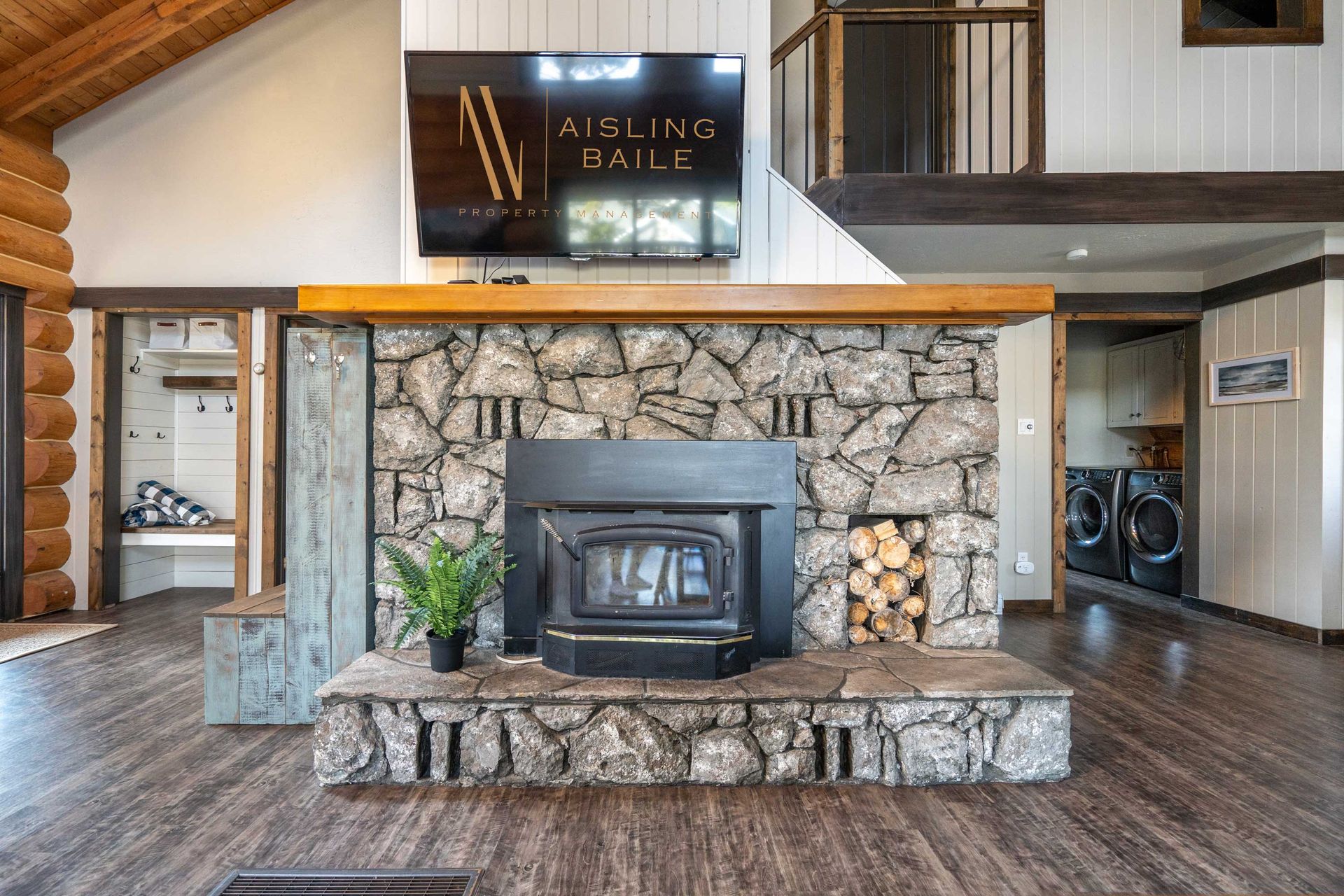 Living room with wood-burning fireplace of the Canterbury Lodge, an Invermere BC Vacation Rental hosted by Aisling Baile Property Management.