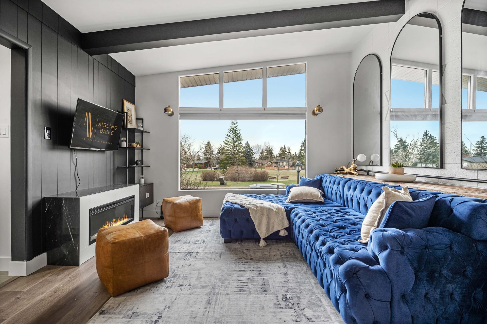 A person wearing blue gloves is cleaning a door handle with a spray bottle.