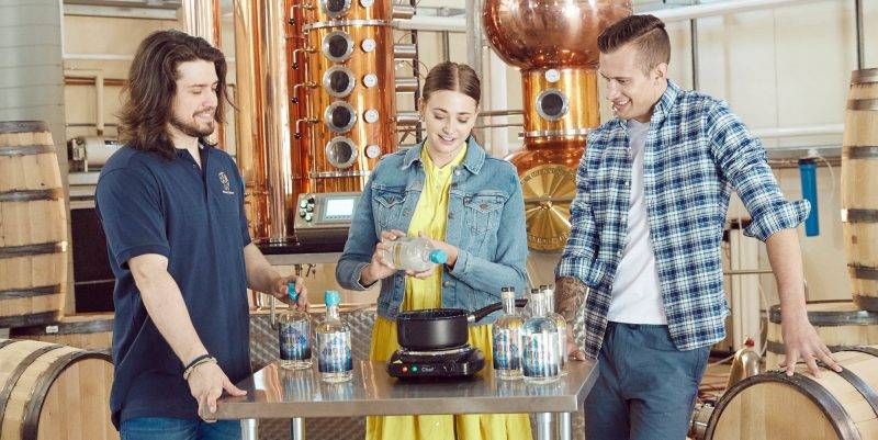 Three brewmasters are sampling their product at Krang Spirits in Cochrane.