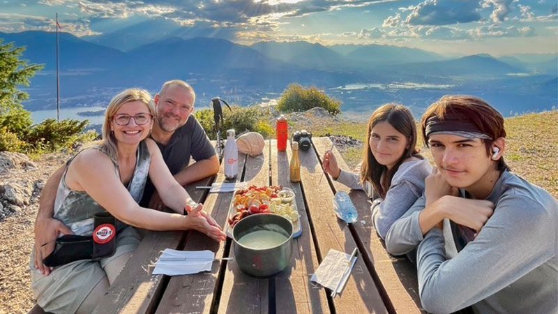 View of 4 people on a Sunsets & Fondue Playwest hike in Invermere, BC.