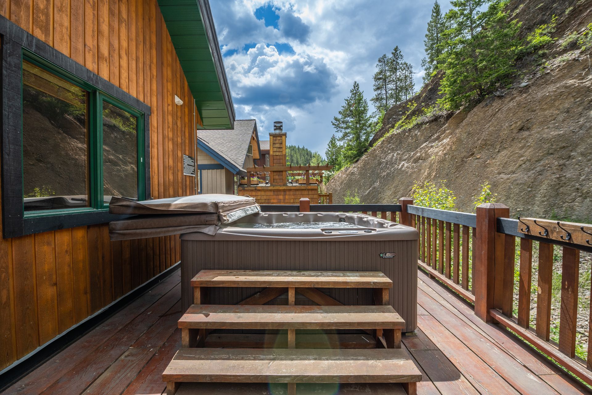 Private hot tub on the wrap-around deck of the Greywolf Lodge in Panorama Mountain Resort. A BC Vacation Rental hosted by Aisling Baile Property Management.