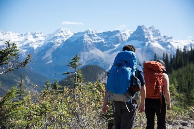 Three people on the main chairlift of Panorama, BC.
