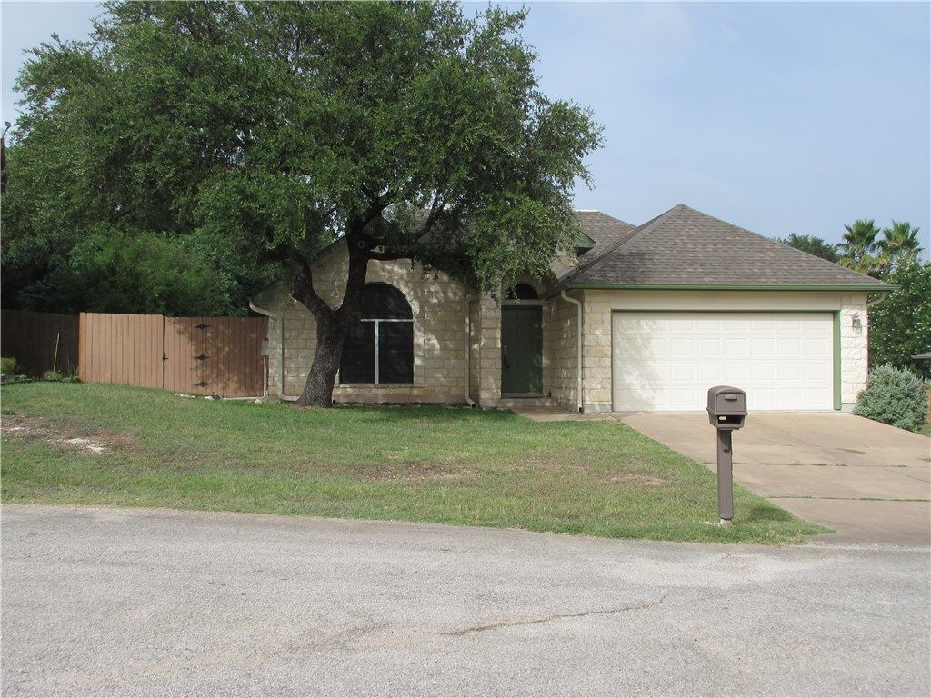 A house with a mailbox in front of it