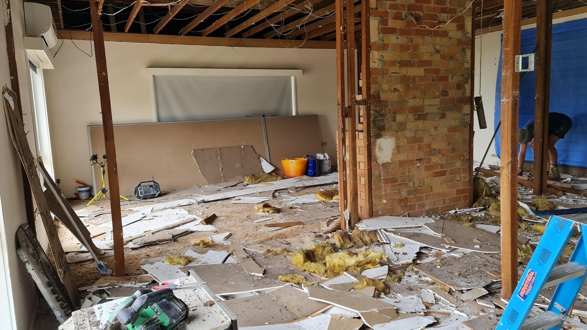 A Room That Is Being Remodelled With A Lot Of Junk On The Floor — Renovate A Space In Woy Woy, NSW