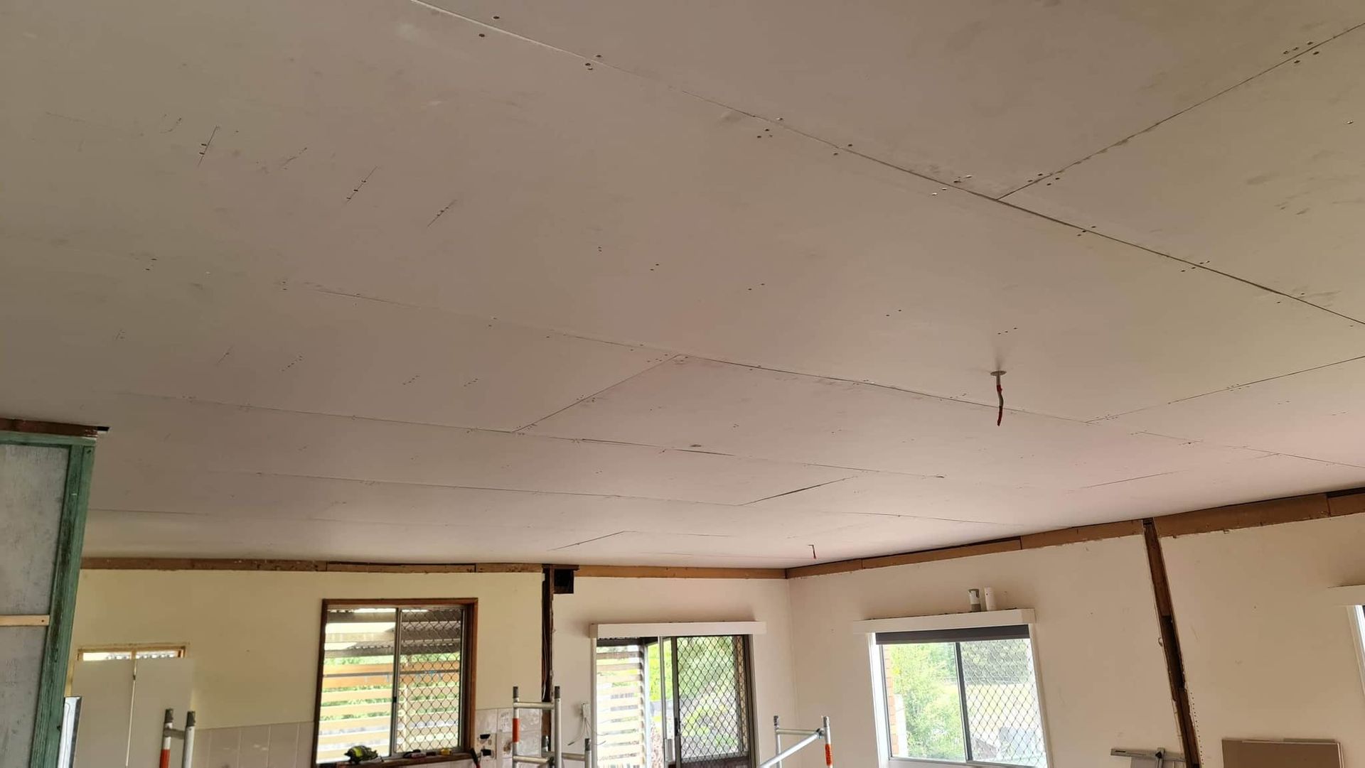 A Room With A White Ceiling And A Lot Of Windows — Renovate A Space In Wyong, NSW