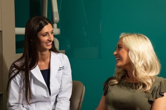 A Doctor And A Patient Are Sitting In A Chair — Clinton, MD — Hamam & Lamb DDS PA