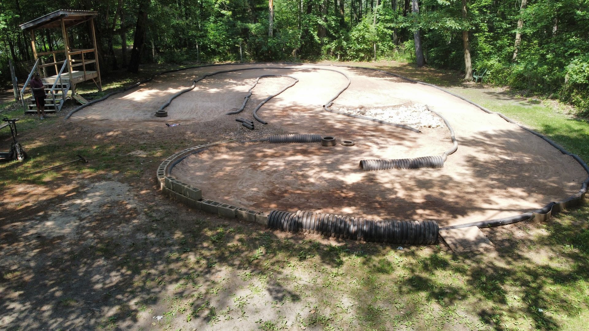 A circle of dirt in the middle of a forest