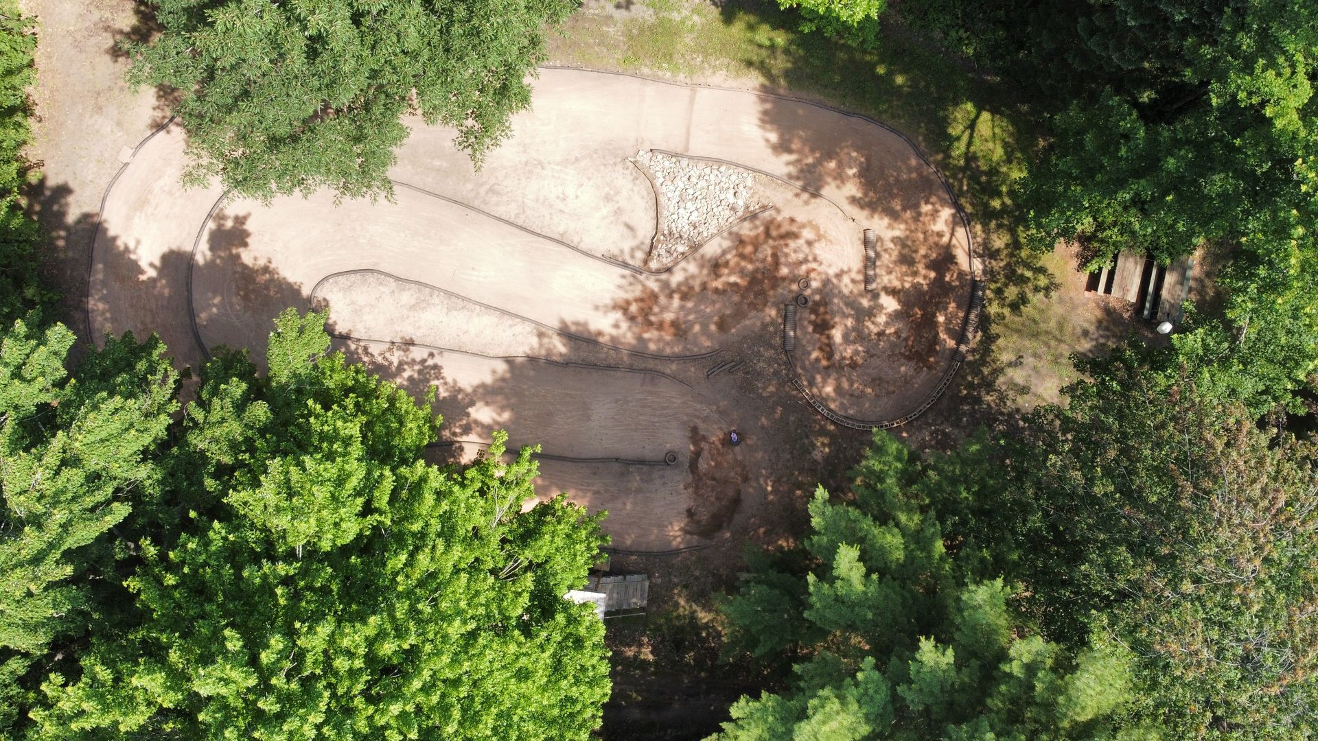 An aerial view of a circle in the middle of a forest