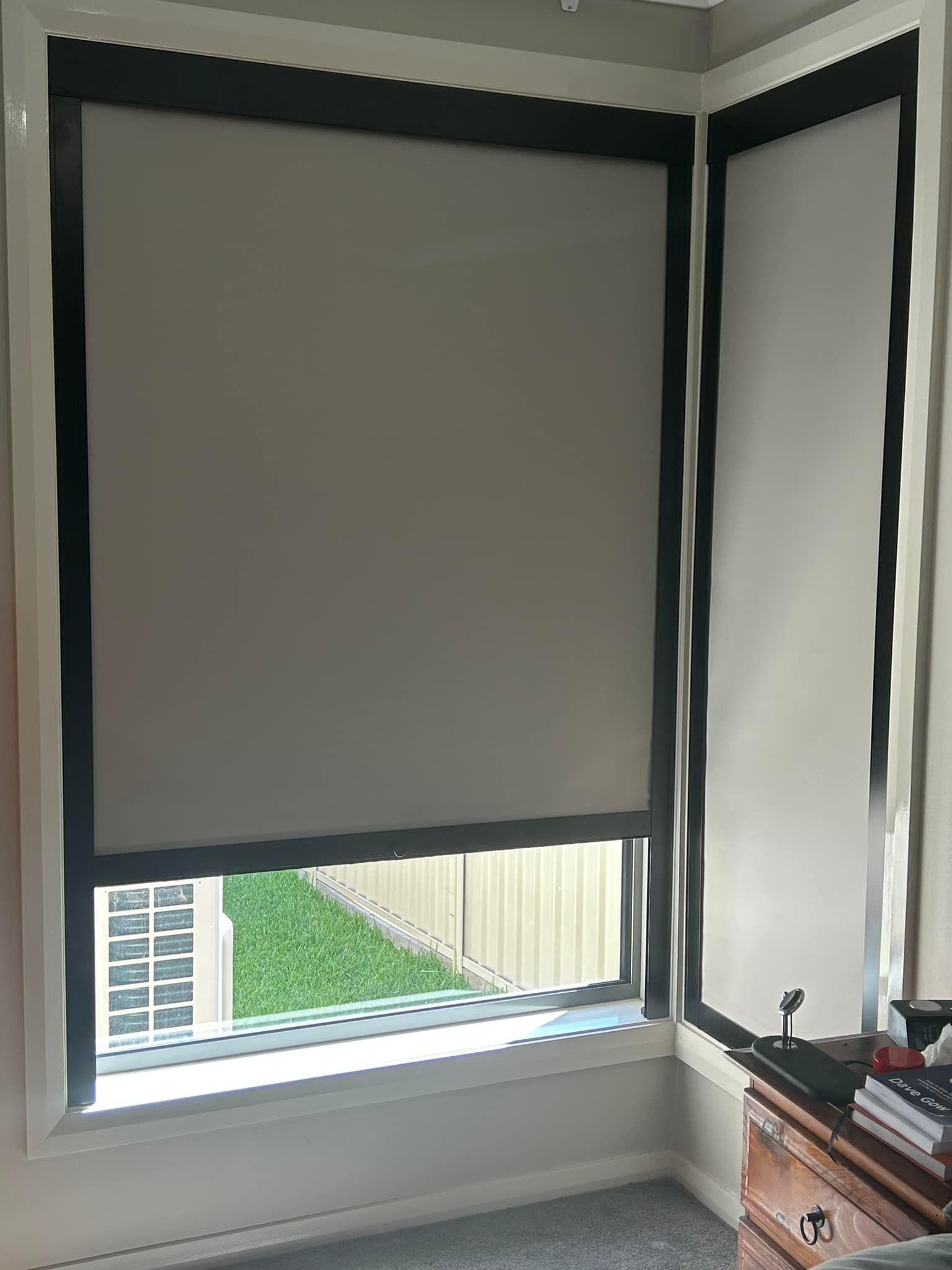 A Bedroom Featuring A Large Window Fitted With Blinds — Maxview Blinds and Shutters in Beresfield, NSW