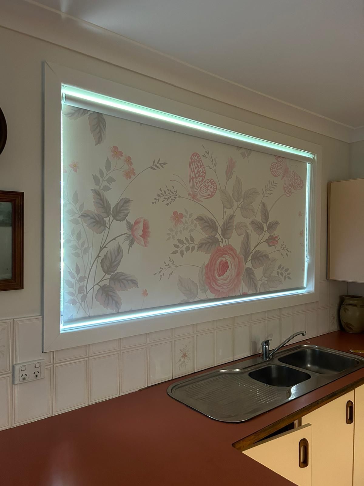 Large Window Blind In The Kitchen With Floral Design — Maxview Blinds and Shutters in Beresfield, NSW