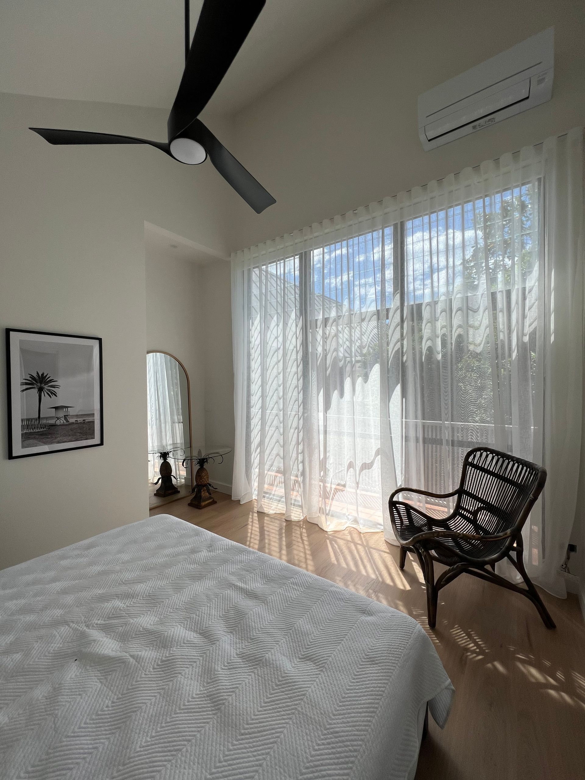 A Row Of White And Black Curtains Hanging On A Window — Maxview Blinds and Shutters in Beresfield, NSW