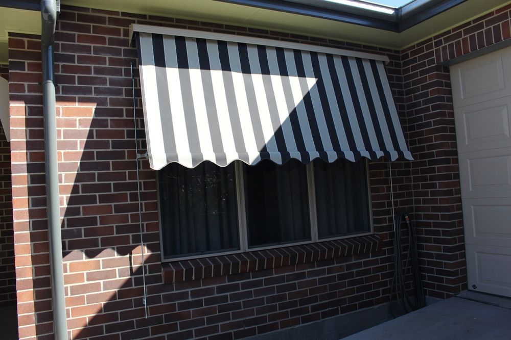 Installed Black and White Striped Awning